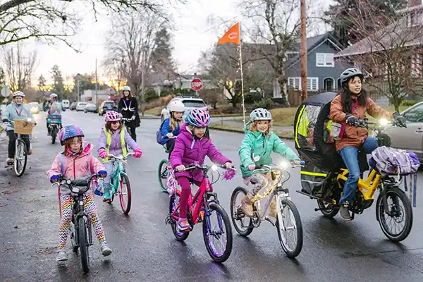 kids riding bikes to school together