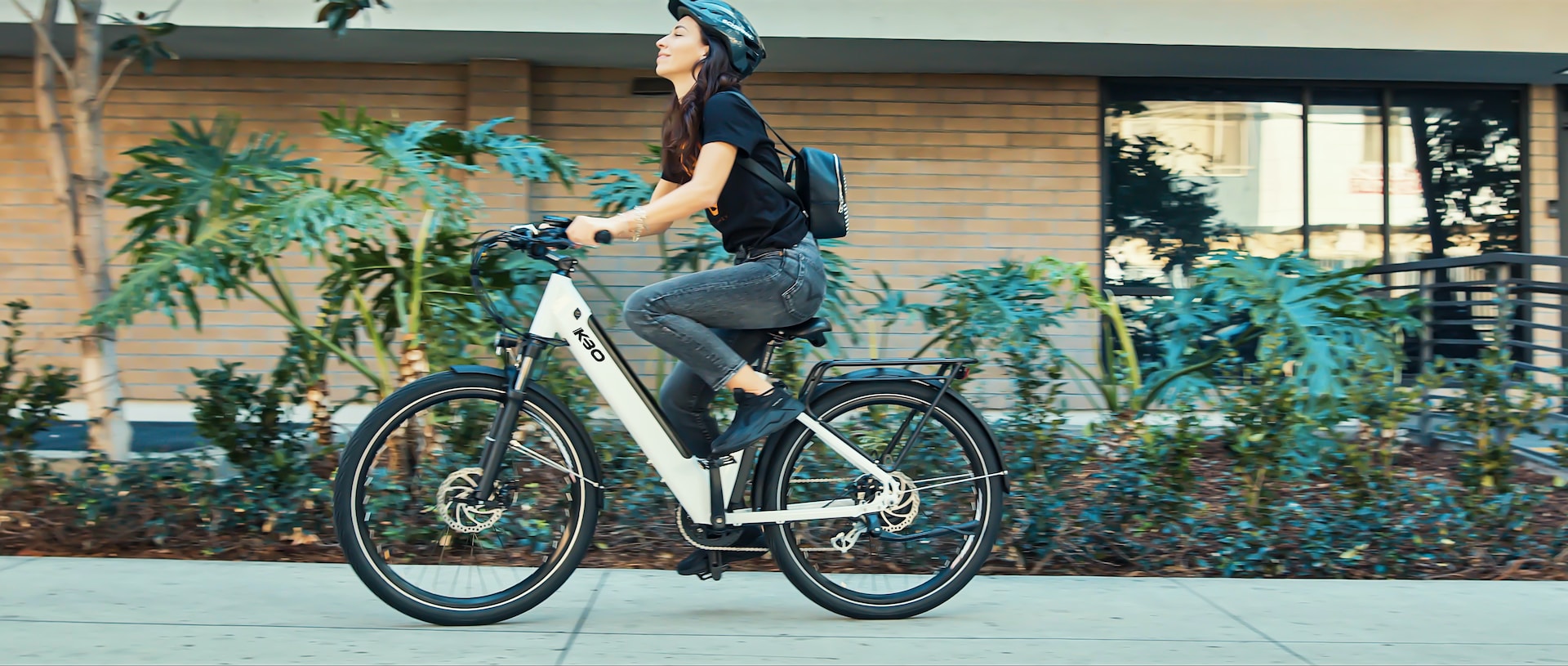 woman riding e-bike